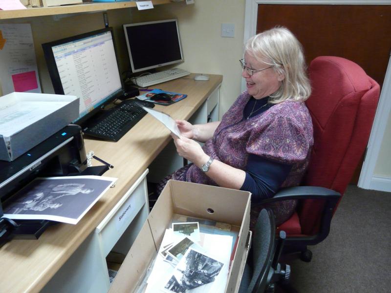 A volunteer working with our collections software