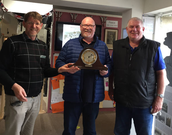 Chairman Steve Gibbon with bothers Gerry and Kenny Durkin and their Grandfather's clock
